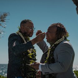 A romantic O'ahu wedding with two grooms, a beachside ceremony, & jumping the "groomstick"