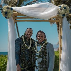 A romantic O'ahu wedding with two grooms, a beachside ceremony, & jumping the "groomstick"