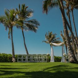 A romantic O'ahu wedding with two grooms, a beachside ceremony, & jumping the "groomstick"