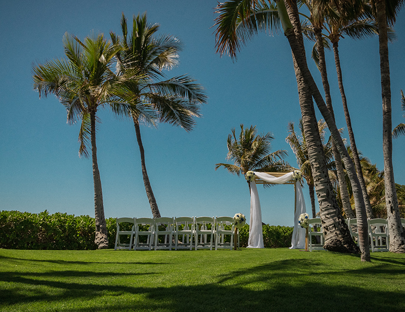 A romantic O'ahu wedding with two grooms, a beachside ceremony, & jumping the "groomstick"