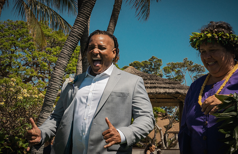 A romantic O'ahu wedding with two grooms, a beachside ceremony, & jumping the "groomstick"