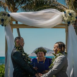 A romantic O'ahu wedding with two grooms, a beachside ceremony, & jumping the "groomstick"