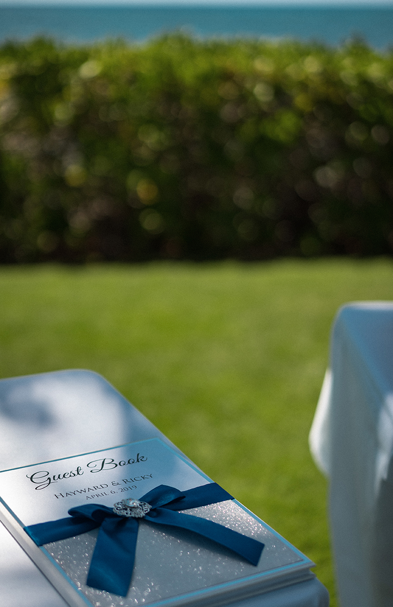 A romantic O'ahu wedding with two grooms, a beachside ceremony, & jumping the "groomstick"