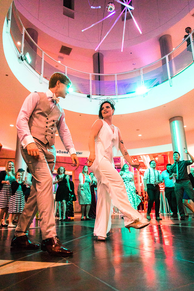 Crowns, pink flowers, & the cosmos at this Chabot Space Center wedding