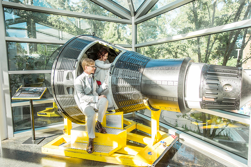Crowns, pink flowers, & the cosmos at this Space Center wedding