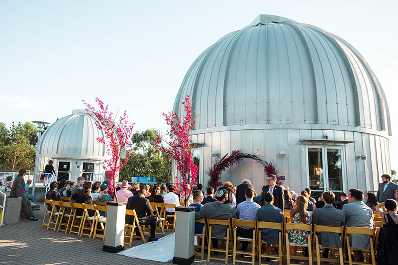 Crowns, pink flowers, & the cosmos at this Space Center wedding