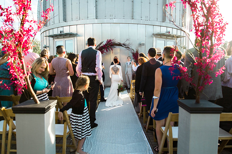 Crowns, pink flowers, & the cosmos at this Space Center wedding