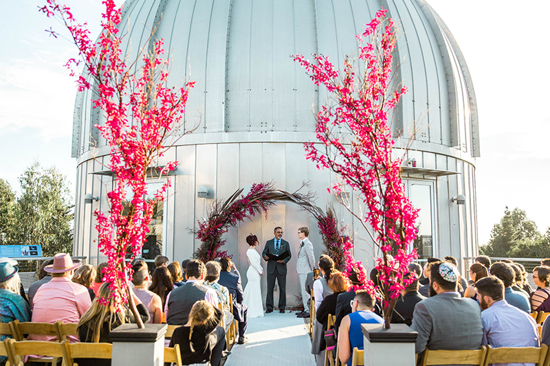 Crowns, pink flowers, & the cosmos at this Space Center wedding