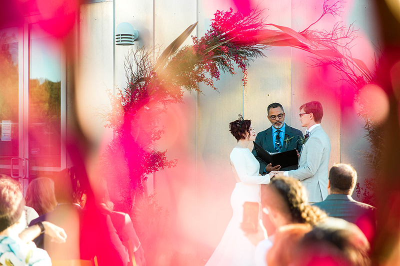 Crowns, pink flowers, & the cosmos at this Space Center wedding