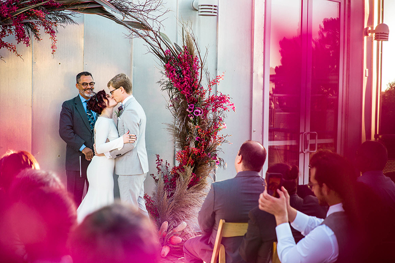 Crowns, pink flowers, & the cosmos at this Space Center wedding