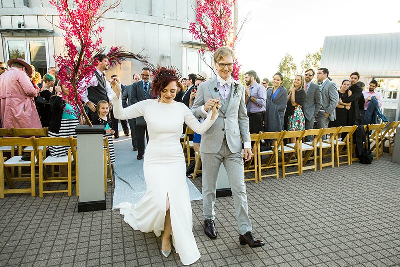 Crowns, pink flowers, & the cosmos at this Space Center wedding