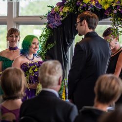 Arcade games & epic foliage at this whimsical green & purple wedding