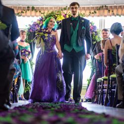 Arcade games & epic foliage at this whimsical green & purple wedding
