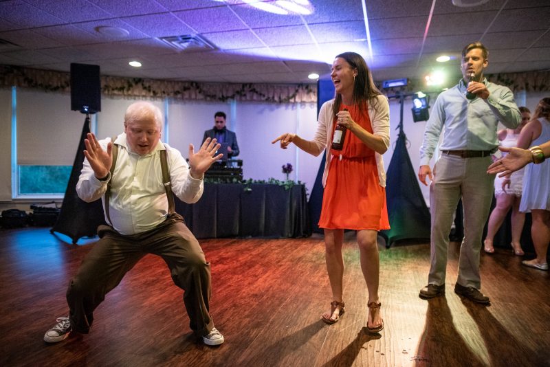 Arcade games & epic foliage at this whimsical green & purple wedding
