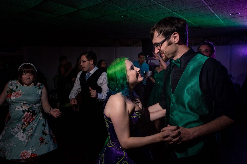 Arcade games & epic foliage at this whimsical green & purple wedding