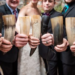 A New York confectionery wedding with smoke bombs, viking horns, & a haunted paintball field