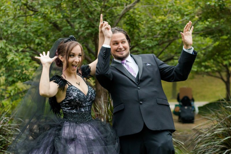 A Hallowedding costume party with a gorgeous purple and black gown