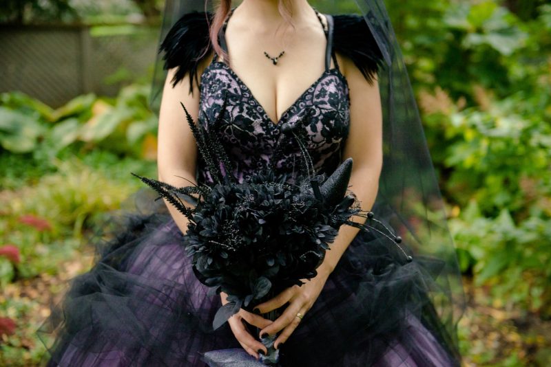 A Hallowedding costume party with a gorgeous purple and black gown