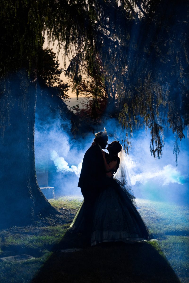 A Hallowedding costume party with a gorgeous purple and black gown