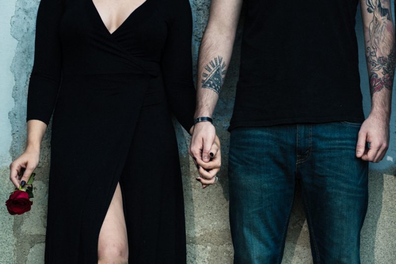 A cemetery engagement photo shoot with pumpkins, colorful smoke, and their Best Cats