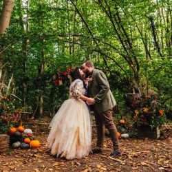 A wild woodland Halloween wedding in Kent with smoke grenades, pumpkins, & an Irish band