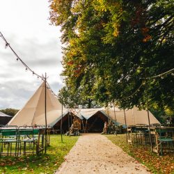 A wild woodland Halloween wedding in Kent with smoke grenades, pumpkins, & an Irish band