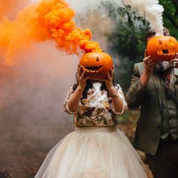 A wild woodland Halloween wedding in Kent with smoke grenades, pumpkins, & an Irish band