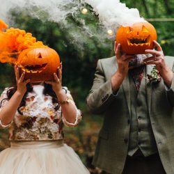 A wild woodland Halloween wedding in Kent with smoke grenades, pumpkins, & an Irish band