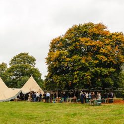 A wild woodland Halloween wedding in Kent with smoke grenades, pumpkins, & an Irish band