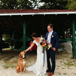 A Maine camp wedding photobombed by the couple's doggo