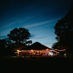 A Maine camp wedding photobombed by the couple's doggo
