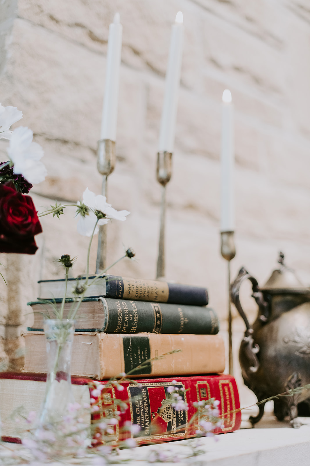 Vintage books on a mantel.