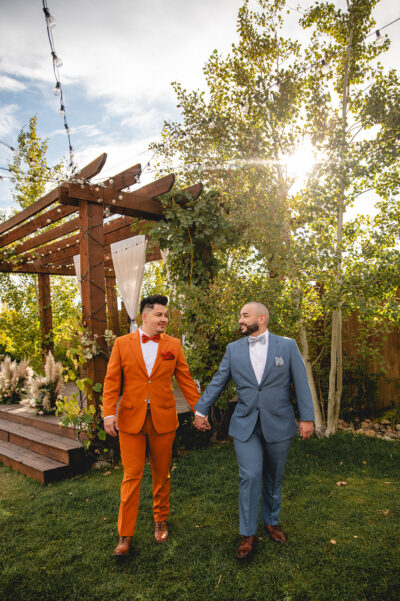 LGBTQ+ Couple walking around vineyard