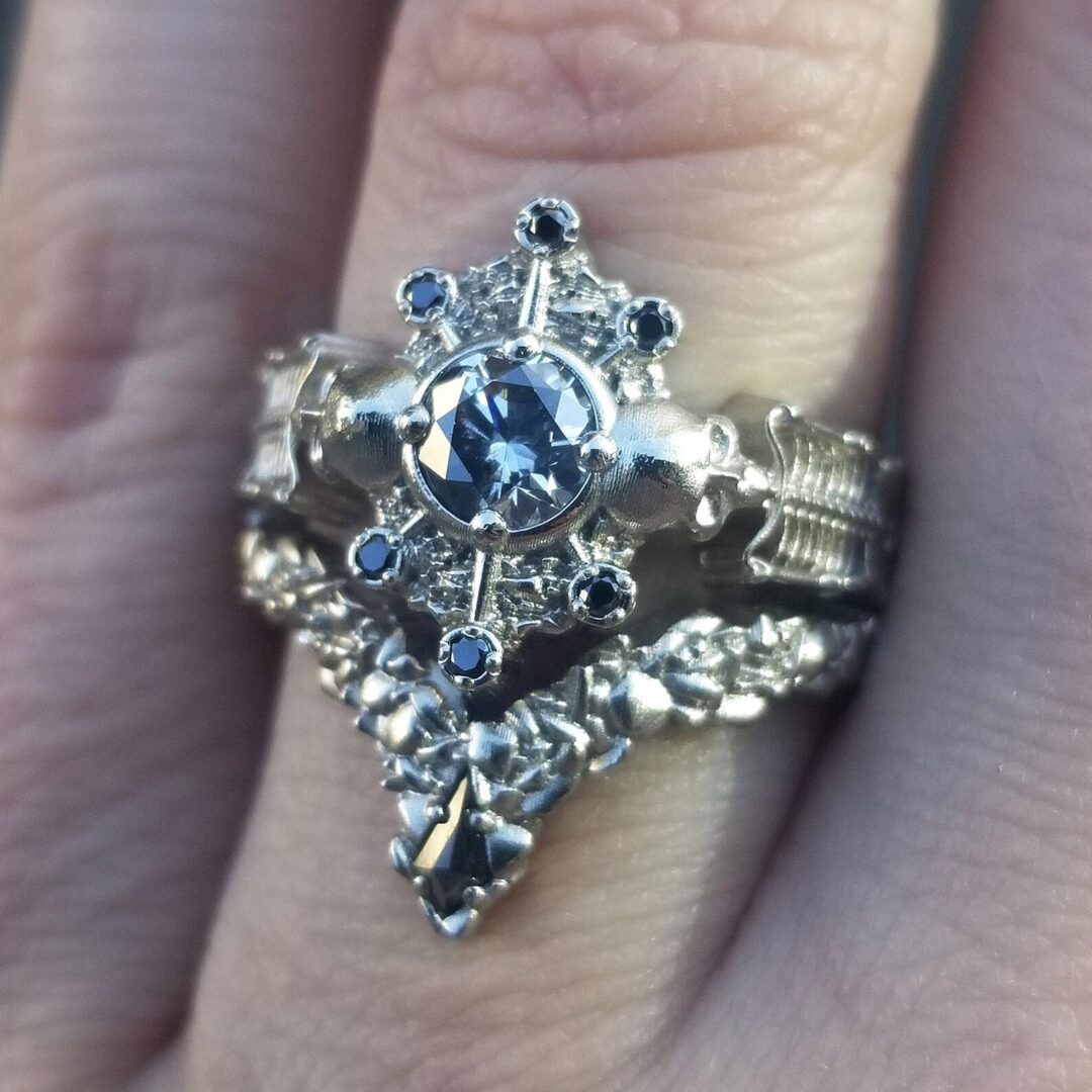 Elegant gothic wedding rings: black diamonds, skulls, sinister details 11 from Offbeat Wed (formerly Offbeat Bride) gothic wedding rings with skulls and skeletons alternative wedding ideas from Offbeat Wed (formerly Offbeat Bride)