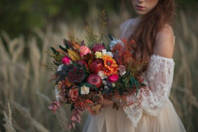 Unique fall wedding Bouquet with apples and burgundy color scheme