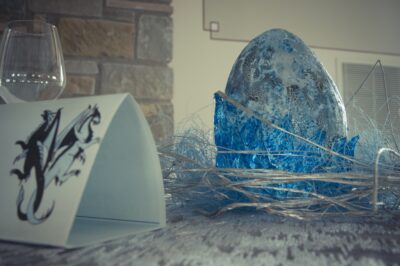 A blue translucent dragon egg on a wedding table