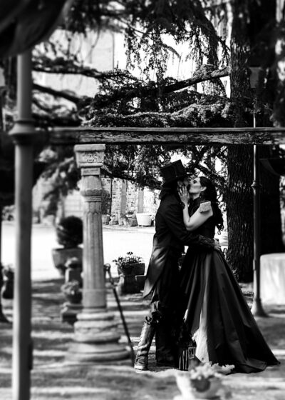 A black and white shot of the spouses kissing after the ceremony