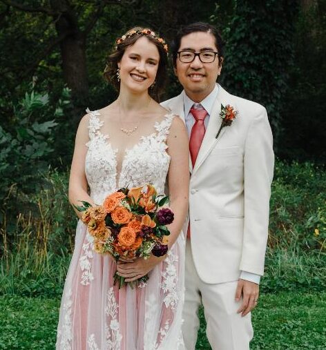 A pink wedding dress and men’s updos gave this wedding reception some stand-out style